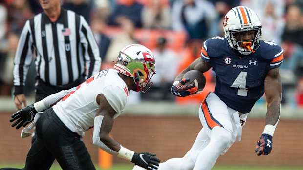 Auburn Tigers running back Tank Bigsby (4) runs the ball as Auburn Tigers take on Western Kentucky Hilltoppers at Jordan-Hare Stadium in Auburn, Ala., on Saturday, Nov. 19, 2022.
